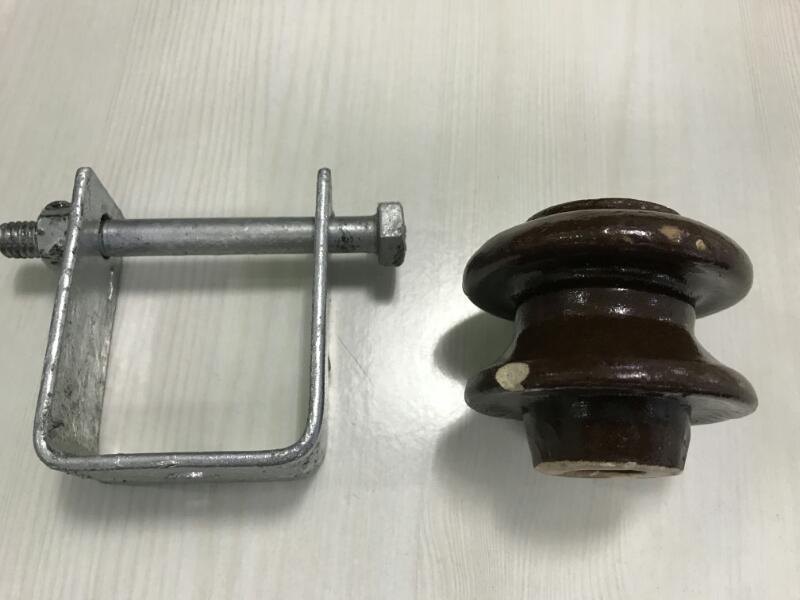 shackle type insulator for electrical installations